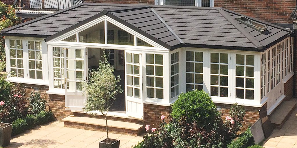 warm conservatory roof with glazed doors and windows