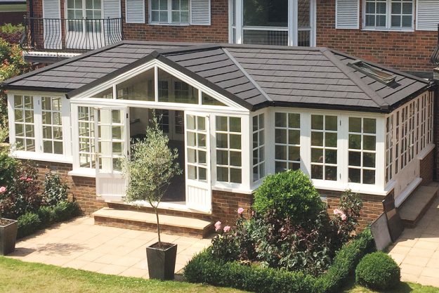 warm conservatory roof with glazed doors and windows